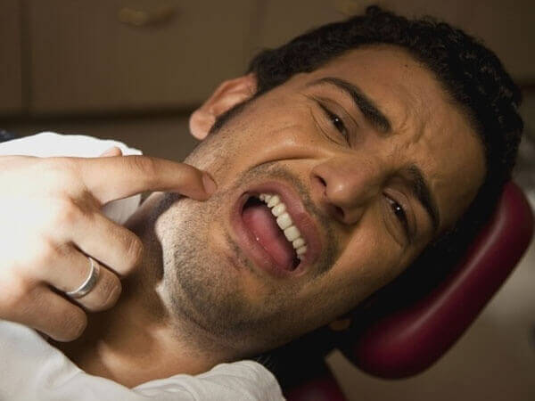 Болит спина отдает в челюсть